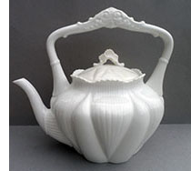 Dainty kettle handled teapot.